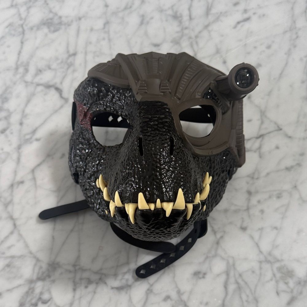 This Jurassic World Track 'N Roar Indoraptor mask Interactive Light Up